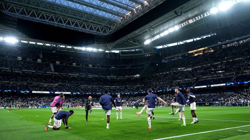 A general view as players of Real Madrid warm up prior to the UEFA Champions League quarter-final first leg match between Real Madrid CF and Manchester City at Santiago Bernabeu Stadium on April 09, 2024, in Madrid, Spain.